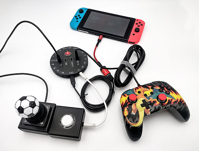 CATCH 22 HID Remapper v6 switch and joystick interface with a Nintendo Switch original, gamepad and joystick and push-button accessibility switch.
