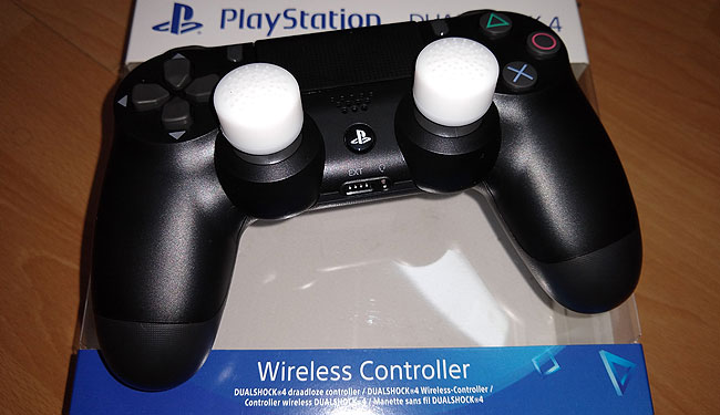 PS4 lightweight controller with thumb-stick extensions.