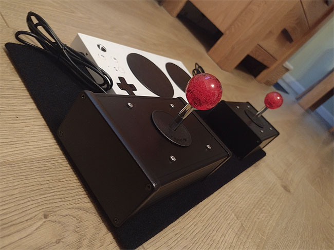 Red Ball bubble tops on an Ultrastik joystick for the Xbox Adaptive Controller.