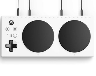 Xbox Adaptive Controller: White slab controller with large black controls.