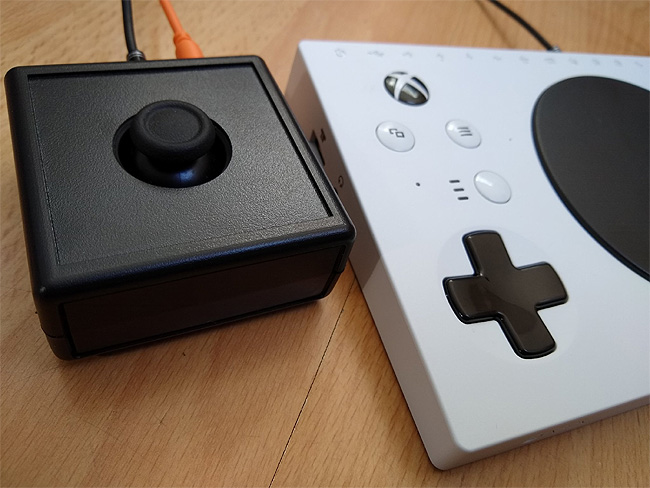 Xbox Adaptive Controller with OneSwitch XAC Mini Joystick attached.