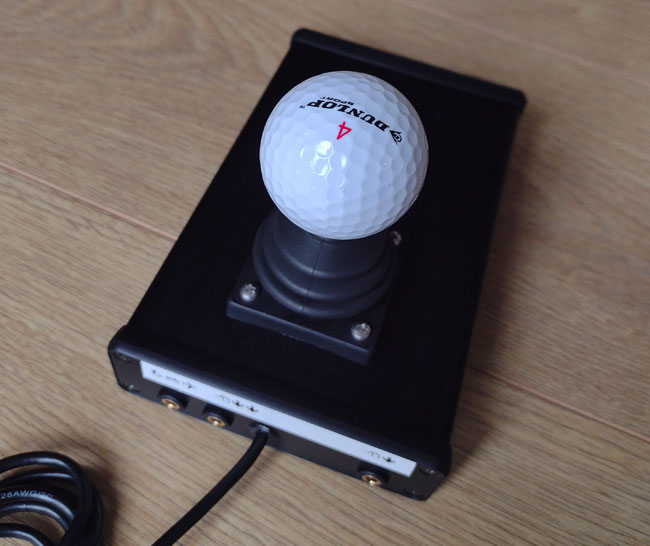 Zik-Zak accessible joystick in black with switch sockets on rear.