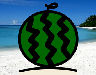A round water melon on a sandy hot beach.
