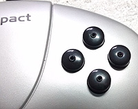4 pilot holes marked in the middle of all 4 buttons.