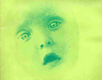 1969 New Worlds magazine cover. Green with a ghostly babie's face staring out at you.
