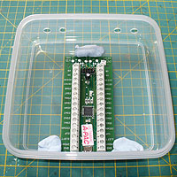 A-PAC being blue-tacked into place for marking out the USB port access hole to be drilled.
