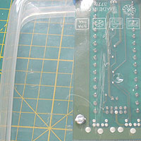 M3 bolt threaded up through the underside of the sandwich box, through the A-PAC PCB.