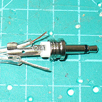 2. Making Holes: Image of a black enclosure box, D9 socket, three files and a D9 sized hole in the case.