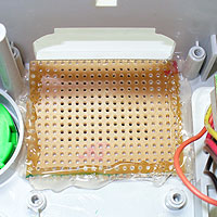 4. Image of a 16 x 20 square of strip board hot glued into place.