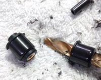 3. Button drilled through with 7.5mm drill bit.