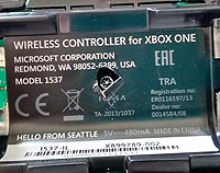 Central screw behind the battery cover.