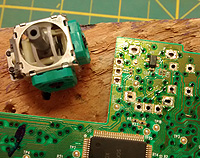 Solder points on the PCB for one side of the joypad motors.